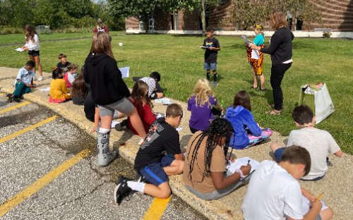 students learning outdoors
