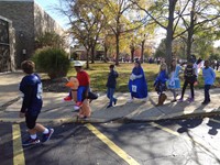 Students marching in Fall Harvest Party Parade.