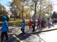 Students marching in Fall Harvest Party Parade.