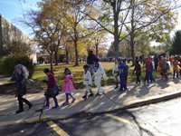 Students marching in Fall Harvest Party Parade.