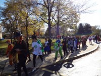 Students marching in Fall Harvest Party Parade.