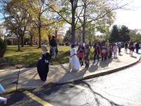 Students marching in Fall Harvest Party Parade.