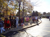 Students marching in Fall Harvest Party Parade.