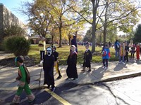 Students marching in Fall Harvest Party Parade.