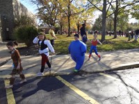 Students marching in Fall Harvest Party Parade.