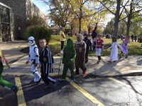 Students marching in Fall Harvest Party Parade.