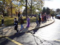 Students marching in Fall Harvest Party Parade.