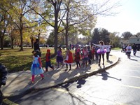 Students marching in Fall Harvest Party Parade.