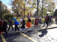 Students marching in Fall Harvest Party Parade.