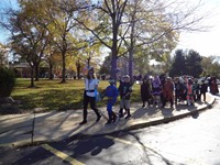 Students marching in Fall Harvest Party Parade.