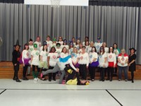 Staff group photo with costumes.  Super Heros!