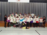 Staff group photo with costumes.  Super Heroes!