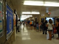 Families walking down hallway.