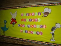 Bulletin board reads, "Bissell Library, Characters Welcome."