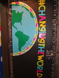 Teacher door reads, "#changingtheworld."