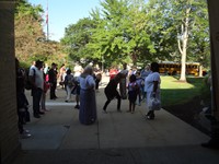 Staff waiting to greet students outside.