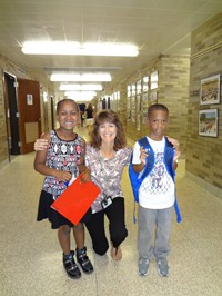 Students and teacher posing for picture.