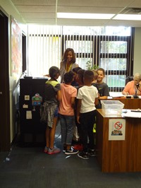 Students reading morning announcements.