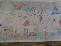 Another photo of bulletin board drawn by art teacher and colored by students.