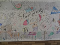 Another photo of bulletin board drawn by art teacher and colored by students.