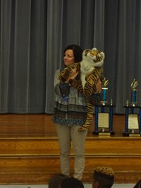 Teacher holding stuffed Tiger