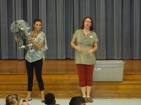 Teacher holding stuffed elephant