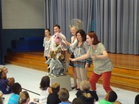 Group presenting information at assembly