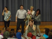 Group presenting information at assembly