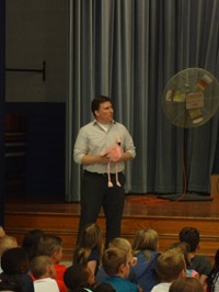 Teacher holding stuffed flamingo