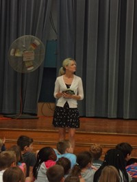 Teacher holding stuffed turtle