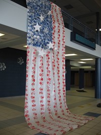 Hanging American flag made of handprints