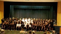 Students performing in a choir on stage