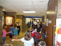 Graduating Students walking through Bissell