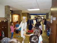 Graduating Students walking through Bissell