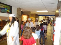 Graduating Students walking through Bissell