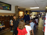 Graduating Students walking through Bissell