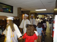 Graduating Students walking through Bissell