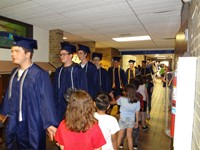 Graduating Students walking through Bissell