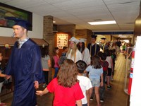 Graduating Students walking through Bissell