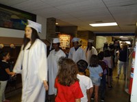 Graduating Students walking through Bissell