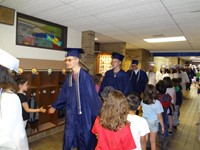 Graduating Students walking through Bissell