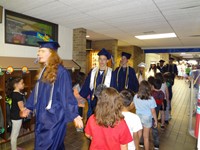 Graduating Students walking through Bissell