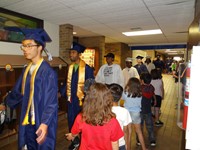 Graduating Students walking through Bissell