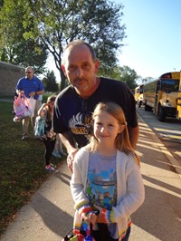 Fathers walking students to school