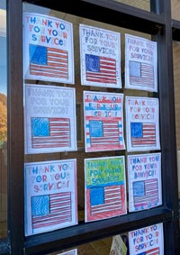 student colorings saying thank you for your service
