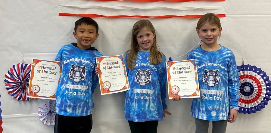 students holding certificates
