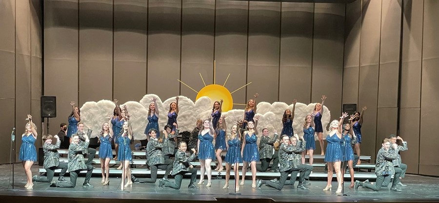 students performing on stage