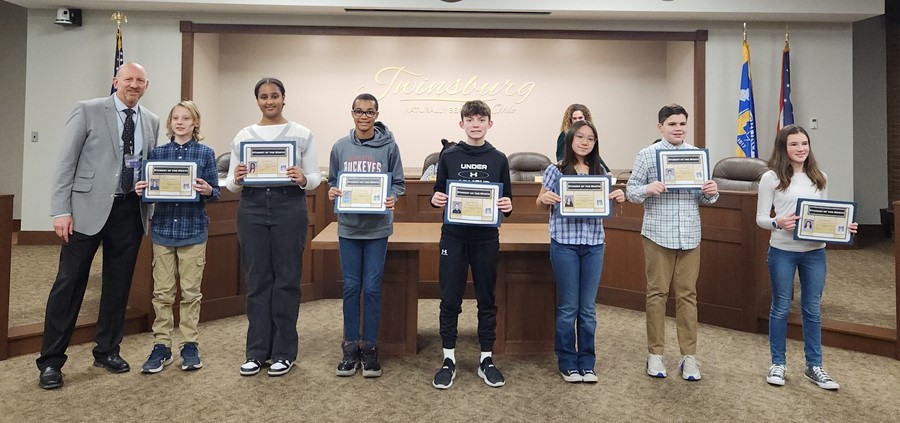 principal and students being recognized for Student of the Month