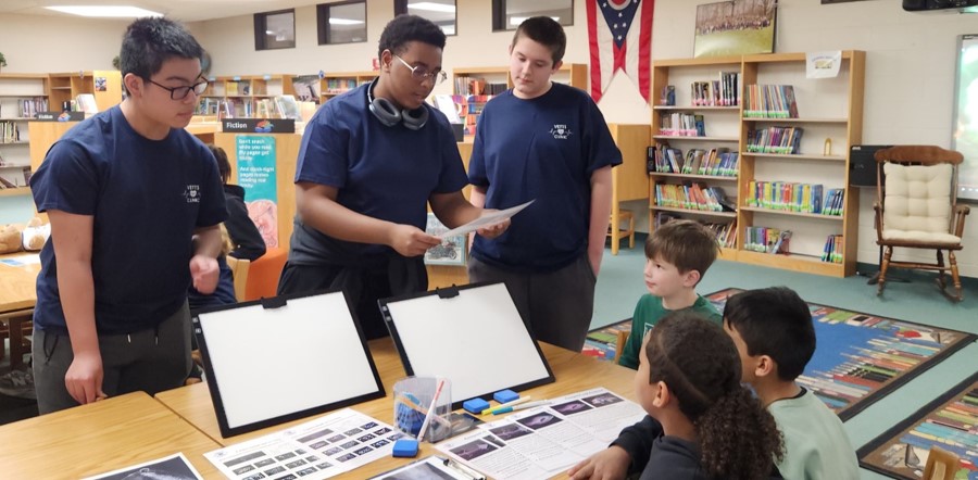 students working with elementary students at the Bissell VETTS Clinic